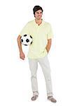 Happy man holding soccer ball on a white background