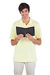Student holding notebook on a white background