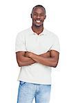 Smiling man posing with arms crossed on a white background