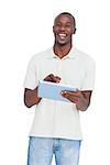 Laughing man using tablet pc on a white background