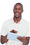 Portrait of a laughing man with tablet pc on a white background