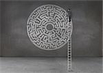 Businessman drawing a labyrinth in an empty dark room