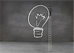 Businessman drawing a light bulb in an empty dark room