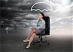 Umbrella graphic above the head of a businesswoman in stormy weather setting