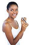 Smiling woman using nail file on white background