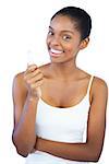 Smiling woman holding her lip balm on white background