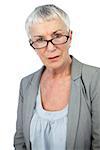 Serious mature woman wearing glasses on white background