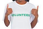Woman wearing volunteer tshirt and giving thumbs up on white background