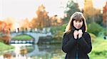 beautiful girl on river shore at autumn