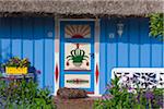 Idyllic house with ornate door and thatched roof, Zingst, Fischland-Darss-Zingst, Coast of the Baltic Sea, Mecklenburg-Western Pomerania, Germany, Europe