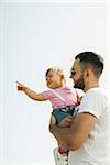 Father Holding Baby Daughter Outdoors, Mannheim, Baden-Wurttemberg, Germany