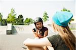 Girls in Skatepark with Smartphone, Feudenheim, Mannheim, Baden-Wurttemberg, Germany