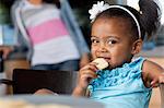 Young girl eating biscuits, portrait