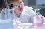 Girl making notes in laboratory