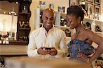 Young couple holding item in vintage shop