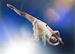 Studio shot of aerialist performing on hoop