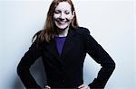 Studio portrait of young businesswoman smiling