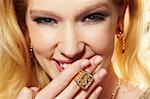 Close up portrait of young woman wearing diamond signet ring