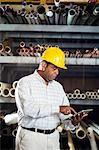Man in warehouse with digital tablet