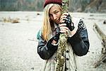 Woman holding log