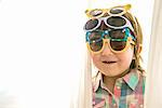 Girl wearing four paris of sunglasses