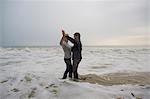 Mature couple dancing on beach