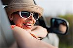 Mature woman wearing sunglasses and sunhat