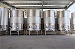 Metal vats in vineyard