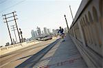 Man skateboarding on pedestrian walkway