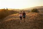 Women walking on dry landscape