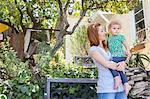 Mother looking at child in arms