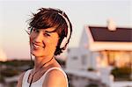 Portrait of smiling woman wearing headphones