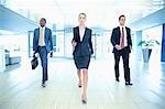 Determined business people walking in lobby