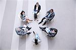 High angle view of business people sitting in circle