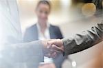 Close up of business people handshaking