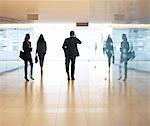 Business people walking in lobby