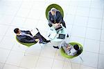 High angle view of business people meeting in lobby