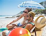 Happy couple relaxing on beach