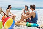 Friends hanging out at beach