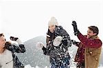 Couple enjoying snowball fight