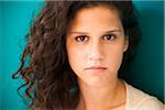 Close-up portrait of teenaged girl, looking at camera