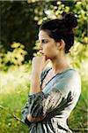 Portrait of teenaged girl outdoors in nature, looking at camera, Germany