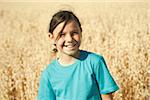 Portrait of girl standing in wheat field, Germany