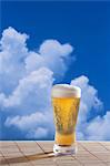 Beer and blue sky with clouds