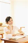 Young woman studying in the living room