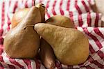 Bosc Pears on a Red and White Striped Towel