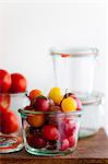 Multi-Colored Cherry Tomatoes in a Glass Container