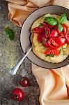 Bowl of Polenta with Fresh Tomatoes and Basil