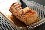 Adding Glaze to a Pork Loin with a Basting Brush