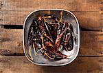 Dried Red Peppers in a Pewter Bowl on Wood